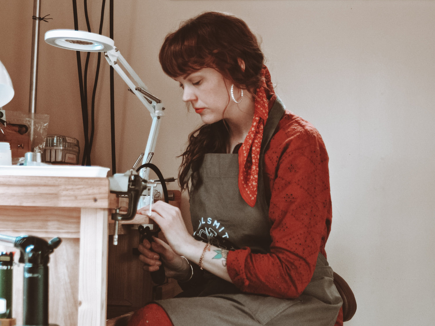 Goldsmith Jenna Bantjes of Arcana Silver Jewelry making jewelry by hand at her bench